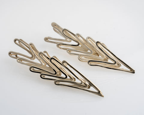 Les boucles d'oreilles Os-coeurs